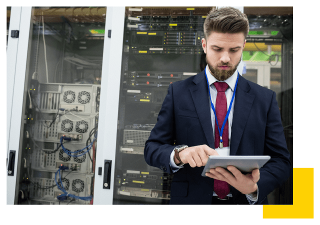 Man working in front of a datacenter